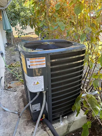 a view of a chairs and table in a backyard