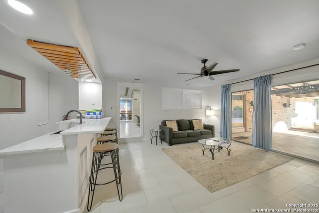 a bedroom with a bed and glass door