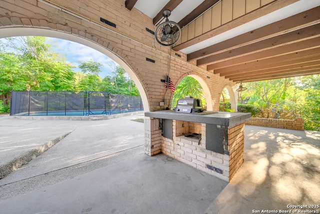 a view of swimming pool with outdoor seating