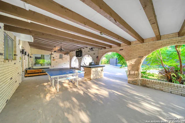 a view of a living room and a wooden floor