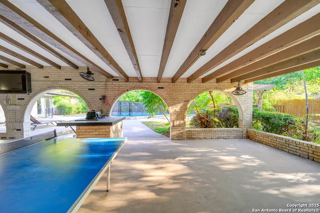 a view of a kitchen with dining table and chairs