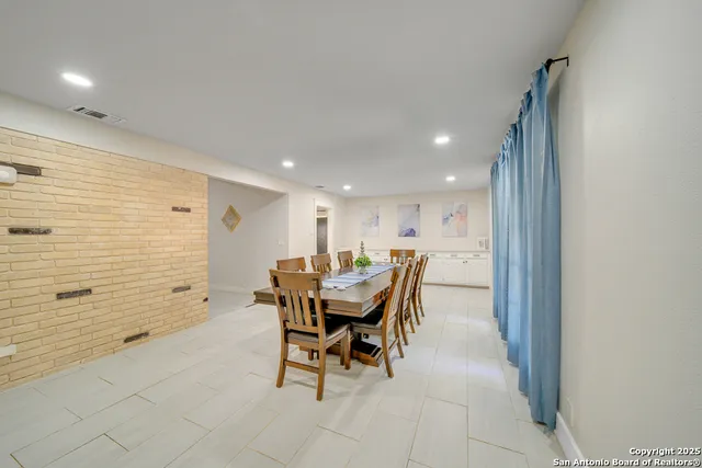 a workspace with furniture and a bathroom