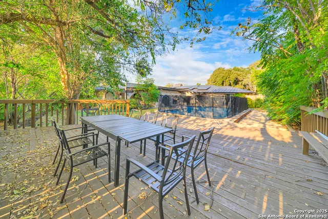 a view of a swimming pool with a patio