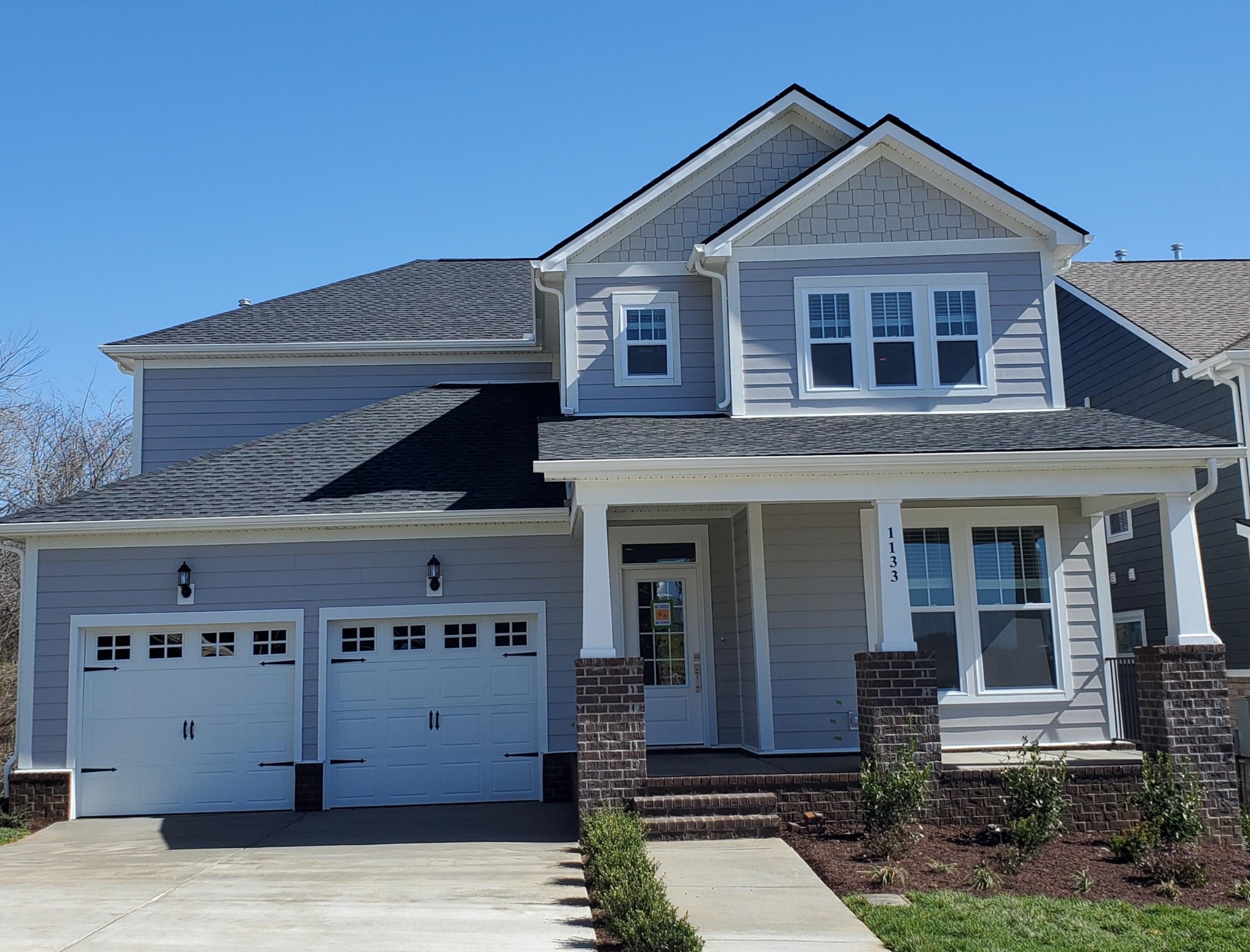 a view of a house with a garage
