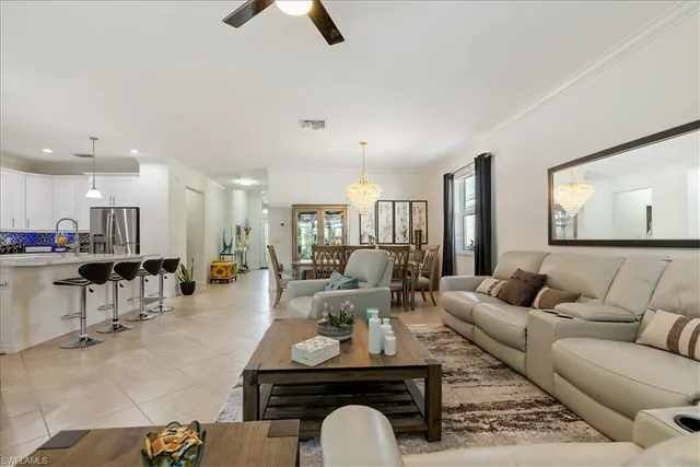 a view of a dining room with furniture wooden floor and chandelier