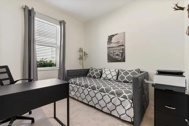 a workspace with furniture and a window