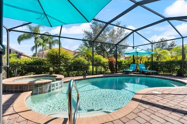 a view of a backyard with sitting area