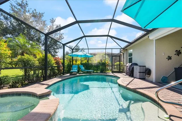 a view of a swimming pool with a patio