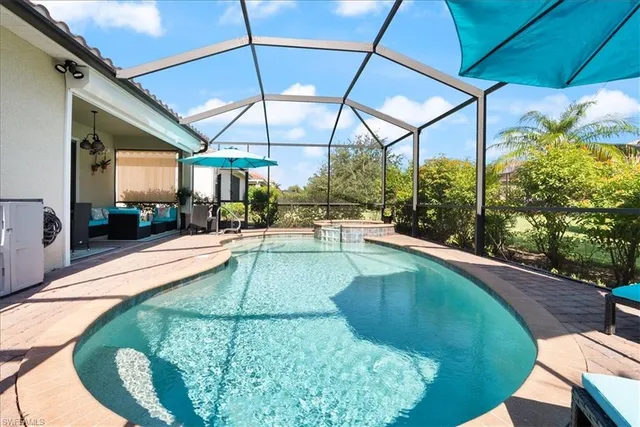 a view of a patio with a table and chairs
