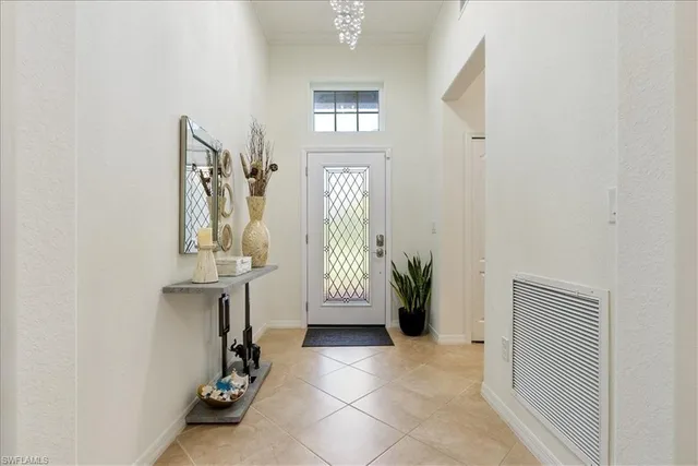 a kitchen with granite countertop white cabinets and stainless steel appliances