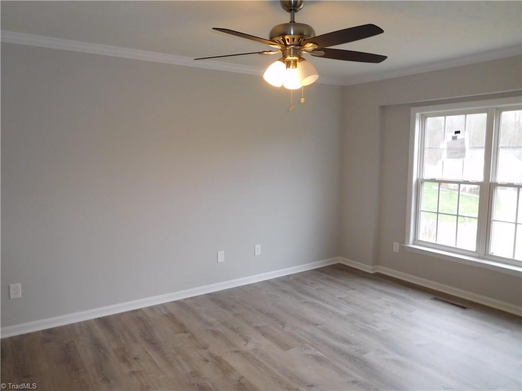 1150 Low Valley Court Rural Hall, NC 27045 - Photo 3 of 15 Living Room w/new vinyl plank flooring & fresh paint.