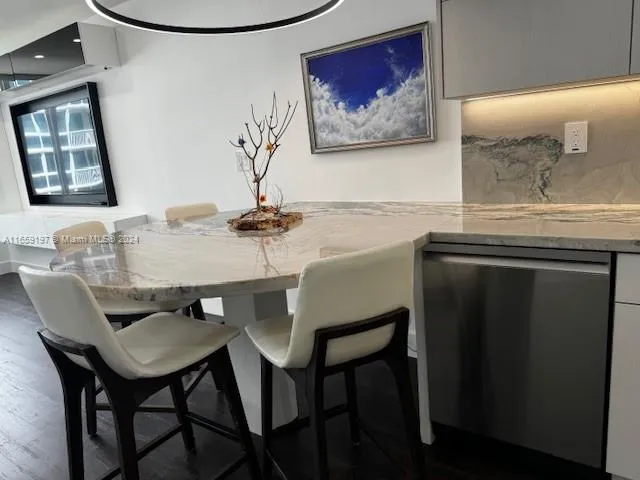 a stove top oven sitting inside of a kitchen