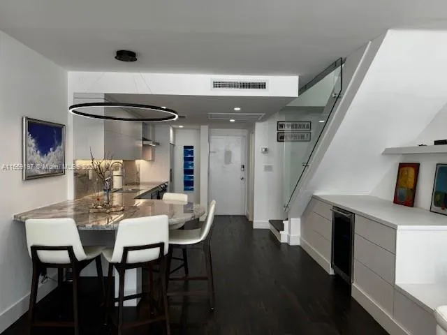 a stove top oven sitting inside of a kitchen