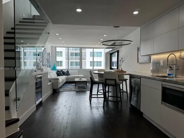 a stove top oven sitting inside of a kitchen