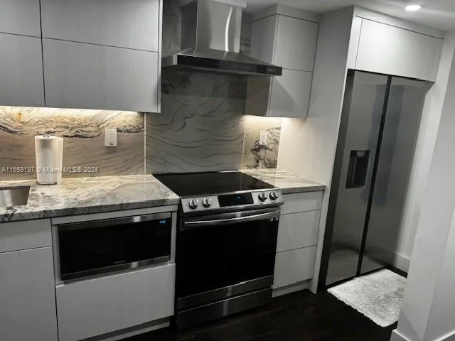 a living room with furniture wooden floor and a table
