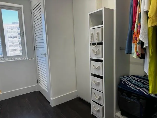 a close up view of a bathroom with a washer and dryer