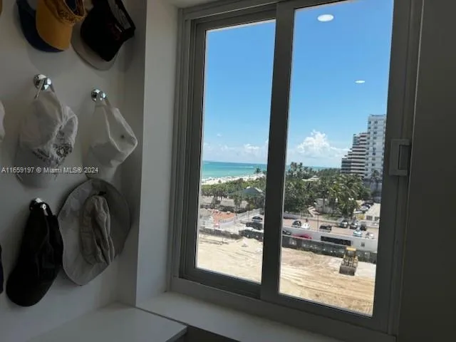 a living room with lots of furniture and a chandelier