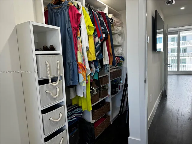 a view of workspace with wooden floor and windows