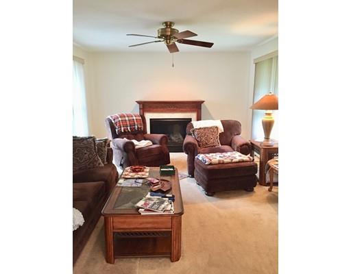 75 Ridge Road Raynham, MA 02767 - Photo 11 of 28 a living room with furniture and a fireplace