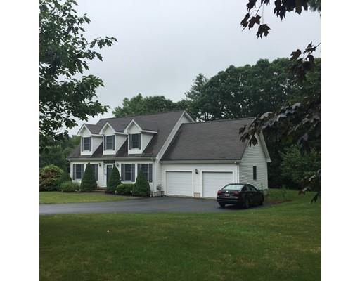 75 Ridge Road Raynham, MA 02767 - Photo 2 of 28 a front view of a house with a garden