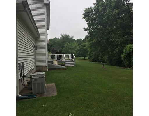 75 Ridge Road Raynham, MA 02767 - Photo 21 of 28 a view of a backyard with couches