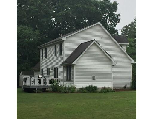75 Ridge Road Raynham, MA 02767 - Photo 25 of 28 a front view of a house with a garden
