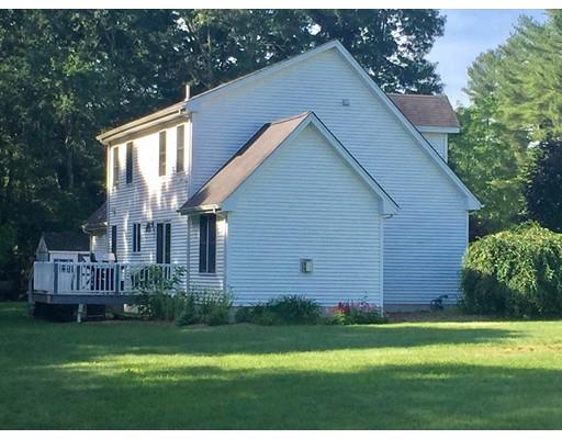75 Ridge Road Raynham, MA 02767 - Photo 27 of 28 a backyard of a house with plants and large tree