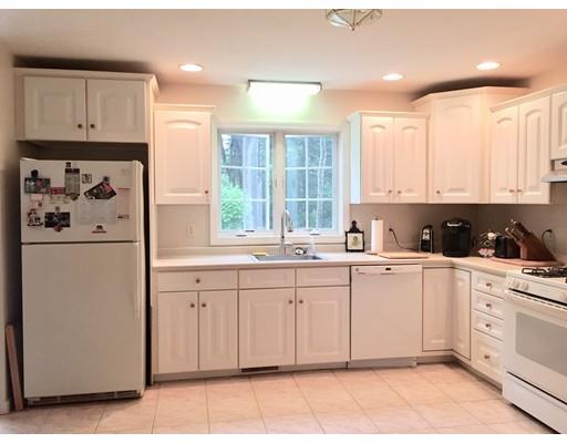 75 Ridge Road Raynham, MA 02767 - Photo 4 of 28 a kitchen with white cabinets and white appliances