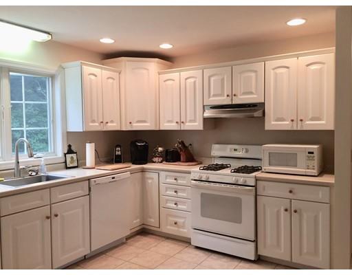 75 Ridge Road Raynham, MA 02767 - Photo 5 of 28 a kitchen with white cabinets sink and appliances