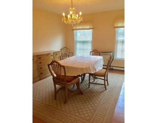 75 Ridge Road Raynham, MA 02767 - Photo 7 of 28 a dining room with furniture and chandelier