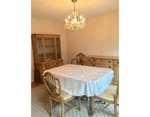75 Ridge Road Raynham, MA 02767 - Photo 8 of 28 a dining room with furniture and chandelier