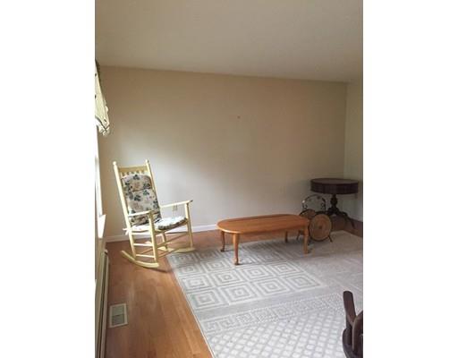 75 Ridge Road Raynham, MA 02767 - Photo 9 of 28 a living room with furniture and a chair