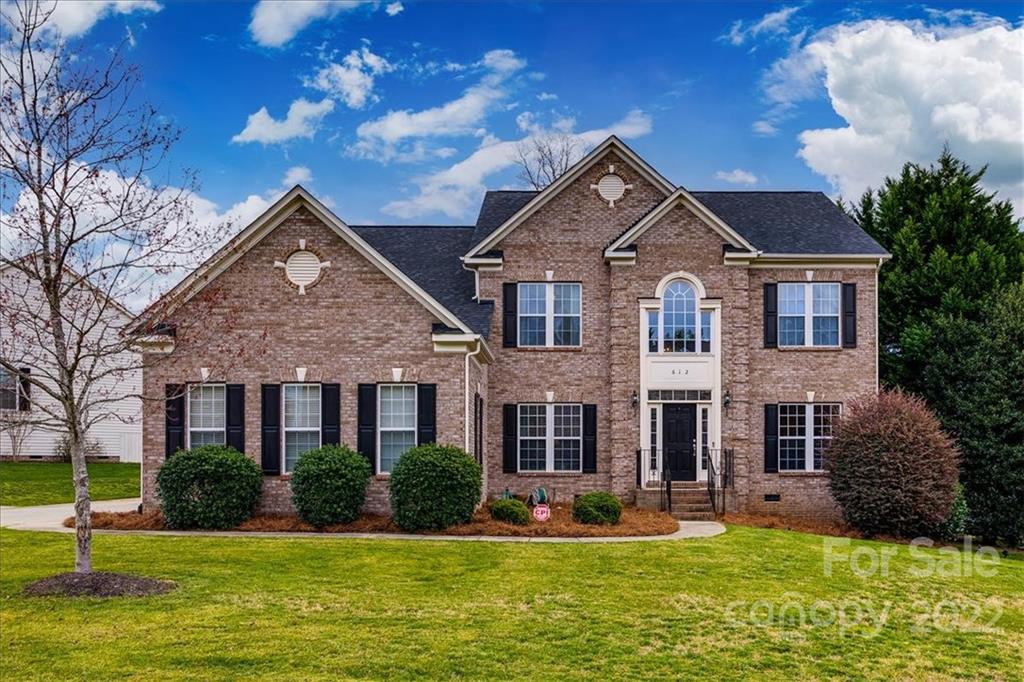 612 Panthers Way Fort Mill, SC 29708 - Photo 1 of 31 a front view of a house with swimming pool and garden