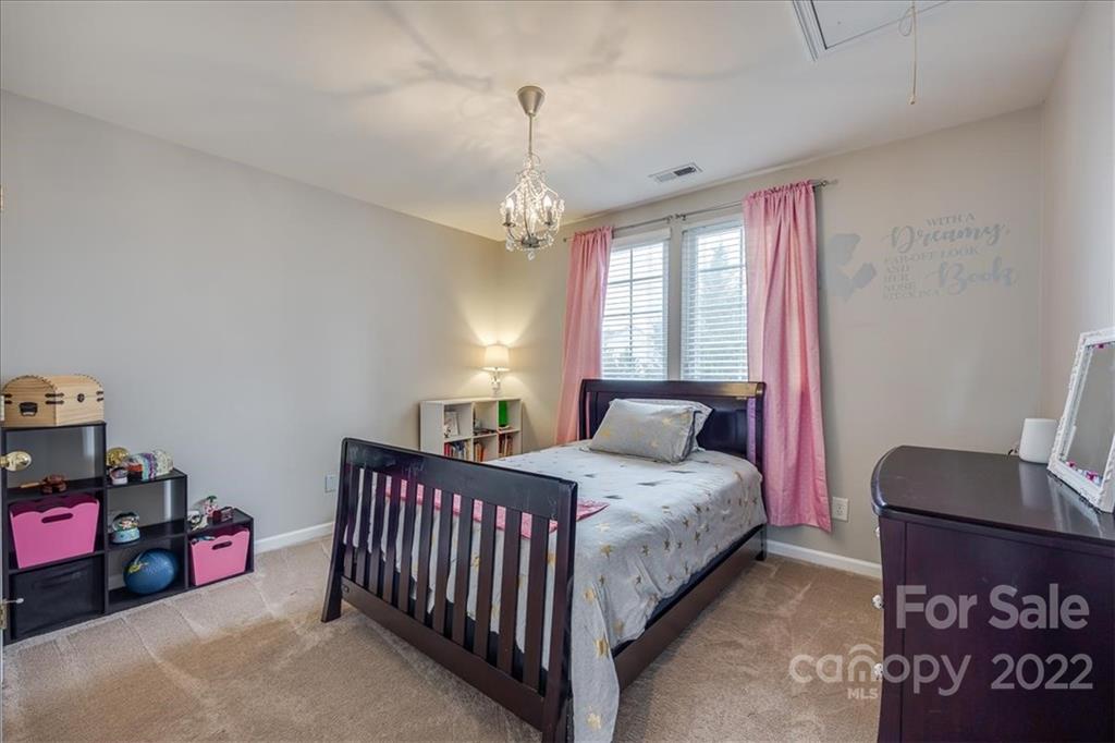 612 Panthers Way Fort Mill, SC 29708 - Photo 19 of 31 a bedroom with a bed and window