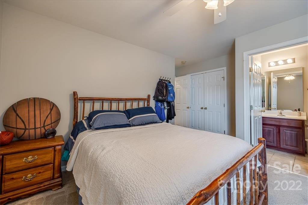 612 Panthers Way Fort Mill, SC 29708 - Photo 22 of 31 a bedroom with two beds and a dresser