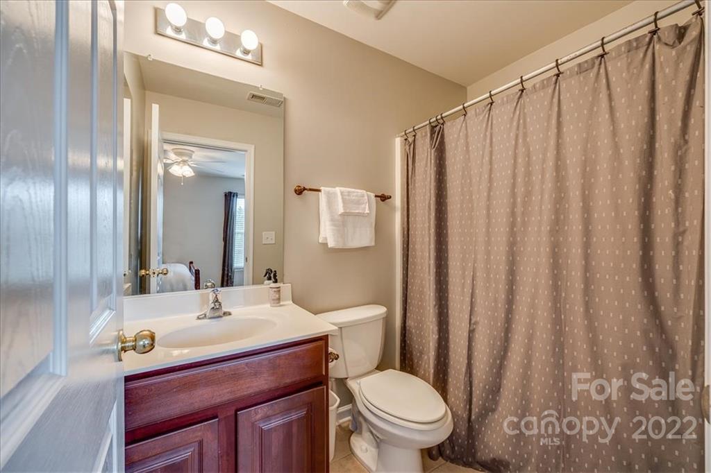 612 Panthers Way Fort Mill, SC 29708 - Photo 23 of 31 a bathroom with a sink a toilet and shower