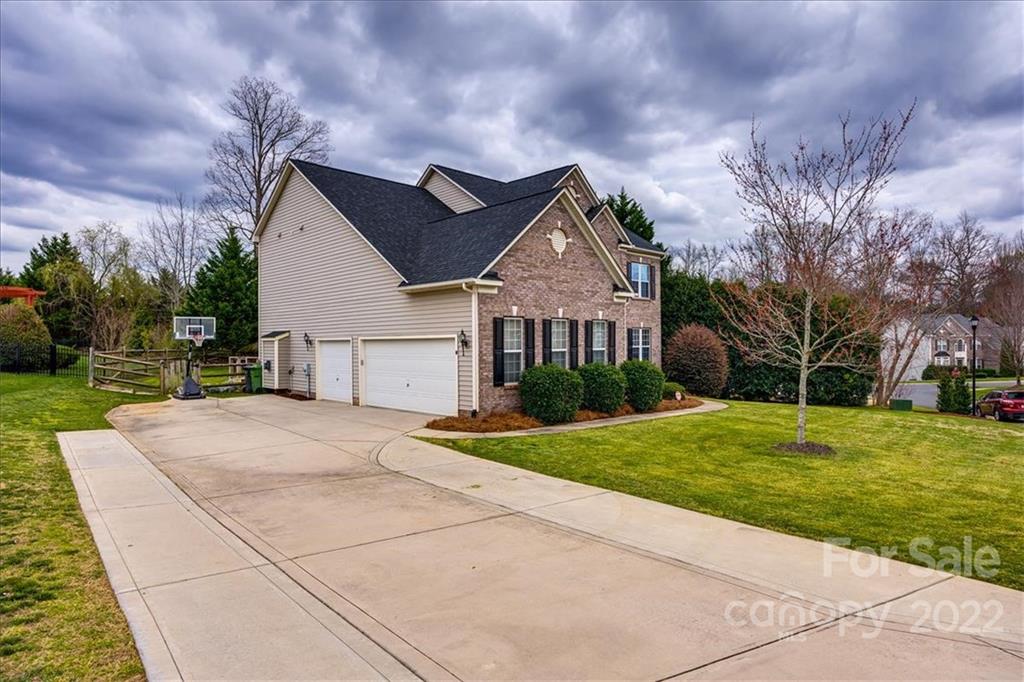 612 Panthers Way Fort Mill, SC 29708 - Photo 28 of 31 a front view of a house with a yard and garage