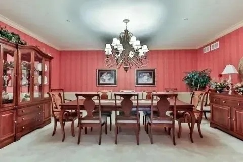 801 North McLean Boulevard, Unit 226 Elgin, IL 60123 - Photo 16 of 19 a view of a dining room with furniture and chandelier