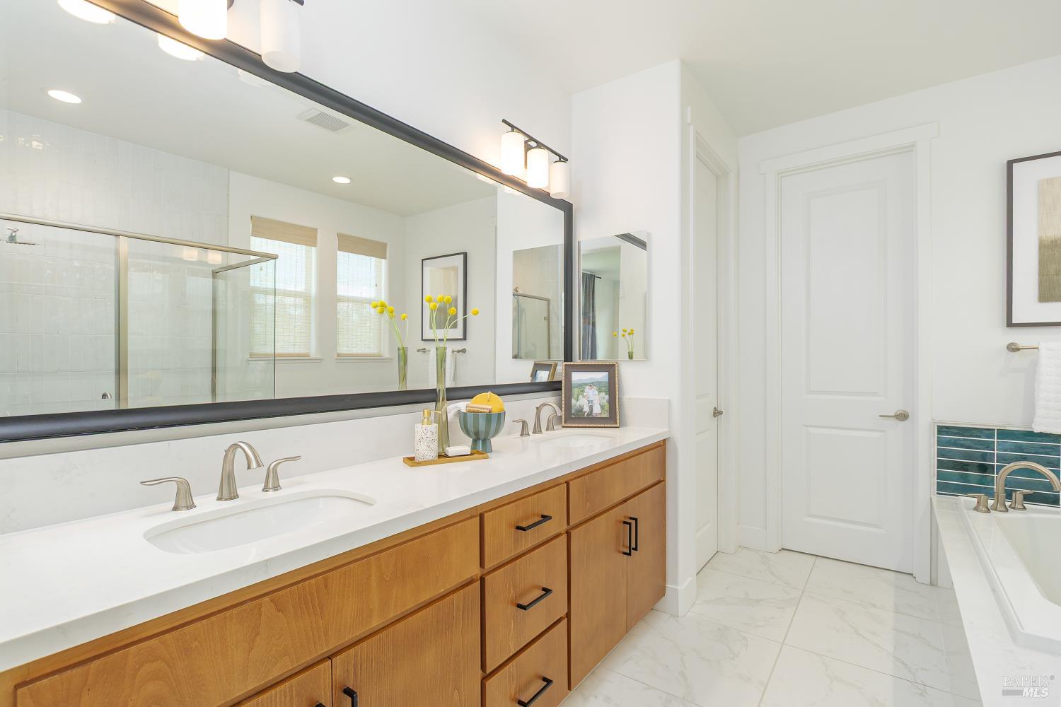 1201 Del Rancho Way Petaluma, CA 94954 - Photo 19 of 56 a bathroom with double sink and a mirror
