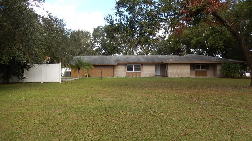 3706 Joe Sanchez Road Plant City, FL 33565 - Photo 1 of 1 a front view of a house with a garden