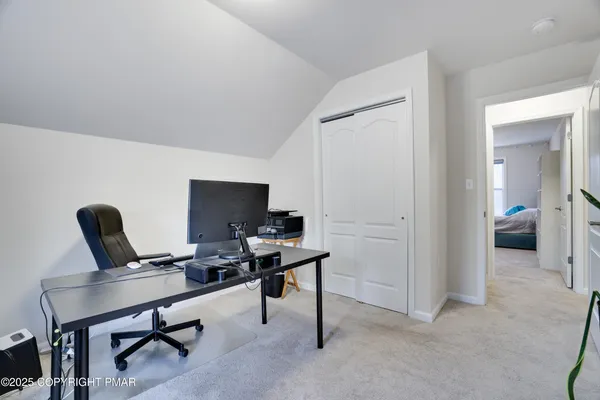 a living room with furniture and flat screen tv