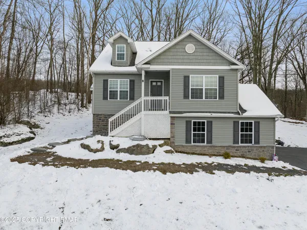 a kitchen with stainless steel appliances granite countertop a stove microwave and cabinets