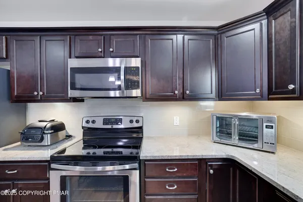 a kitchen with a sink and a window