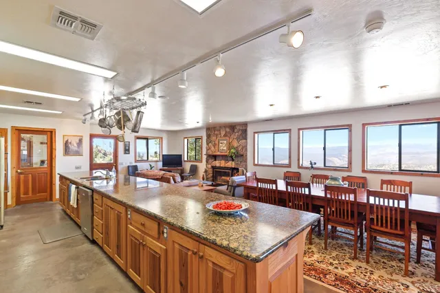 a view of a dining room with furniture window and outside view