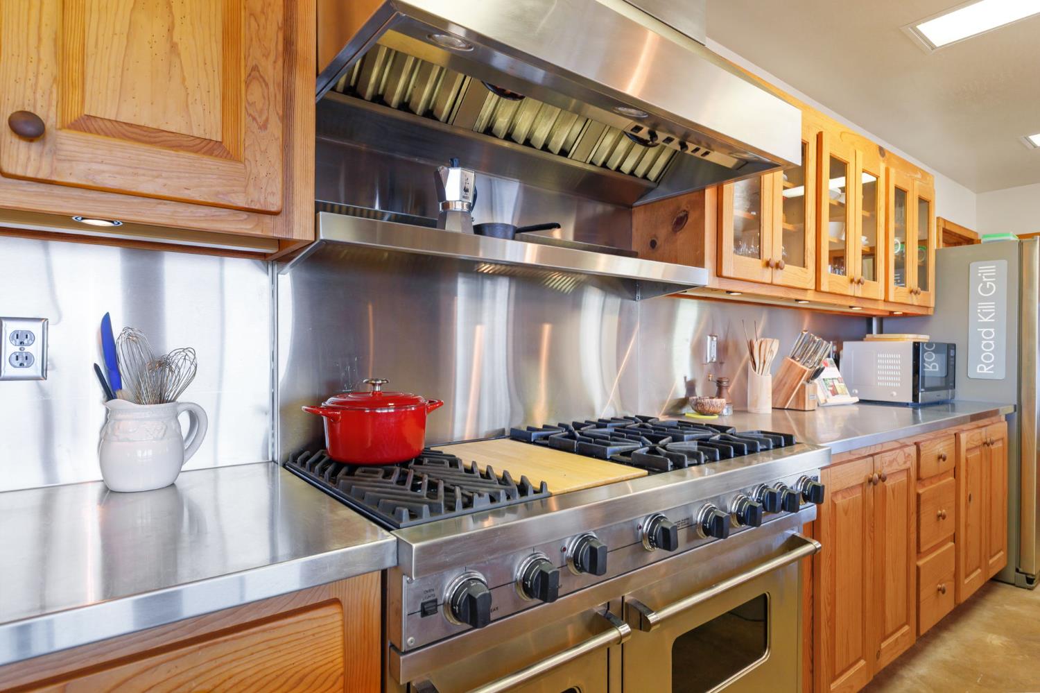 5851 Mt Bullion Ridge Road Mariposa, CA 95338 - Photo 14 of 83 a kitchen with stainless steel appliances granite countertop a stove and cabinets