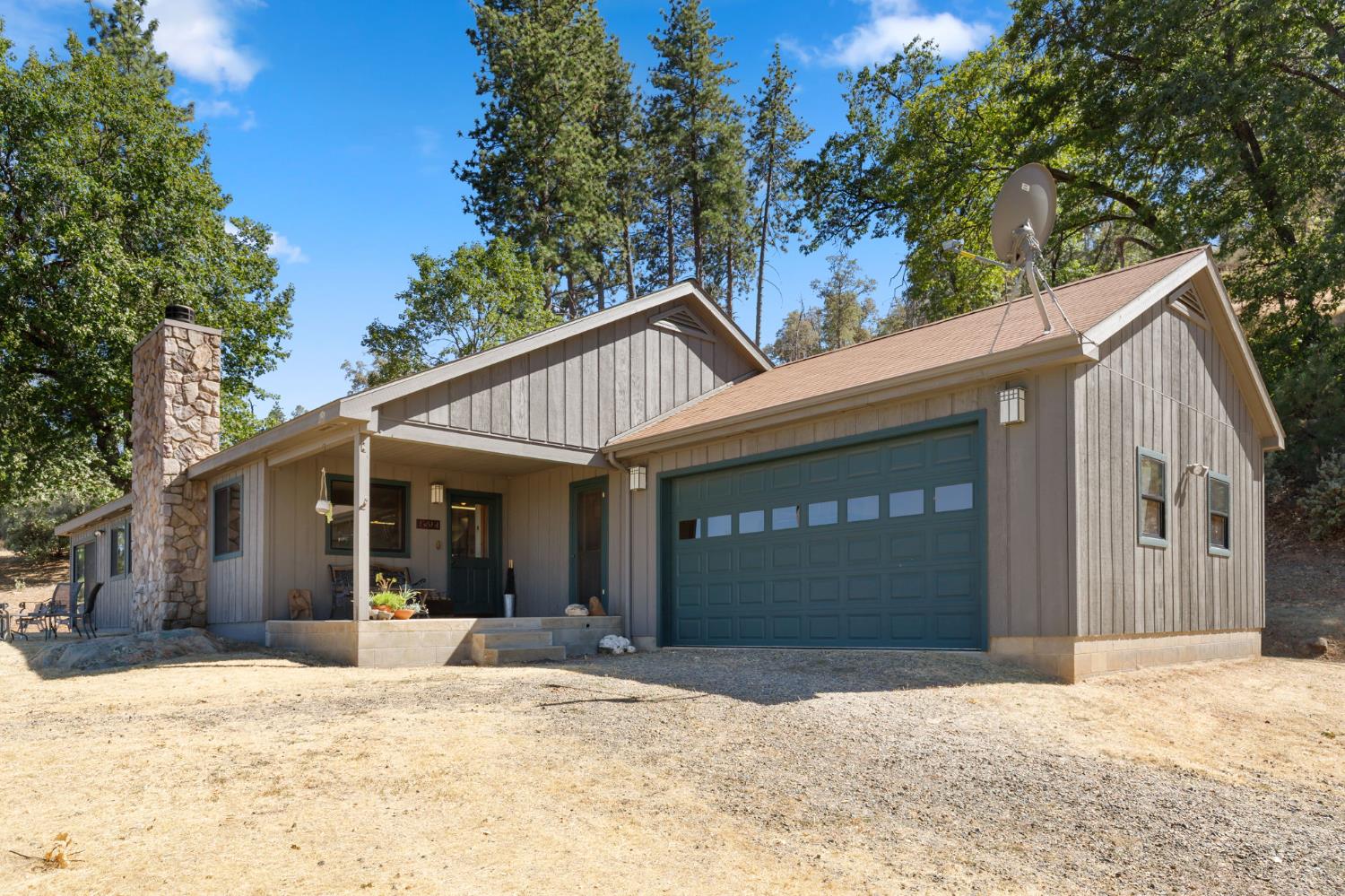 5851 Mt Bullion Ridge Road Mariposa, CA 95338 - Photo 2 of 83 a view of a house with a yard and garage
