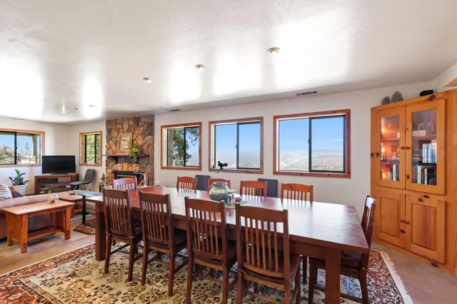 a white toilet sitting next to a shower curtain