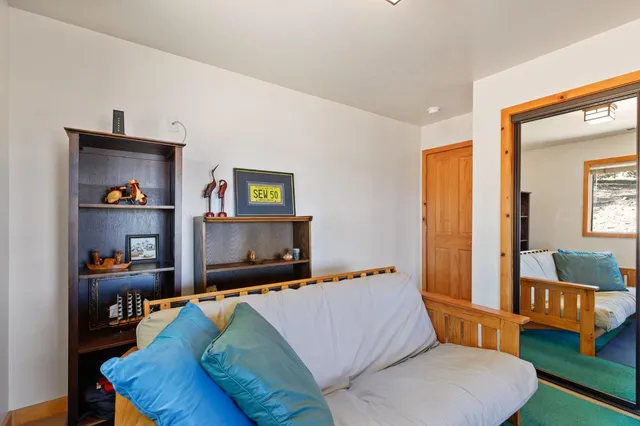 a bedroom with a large bed and a window