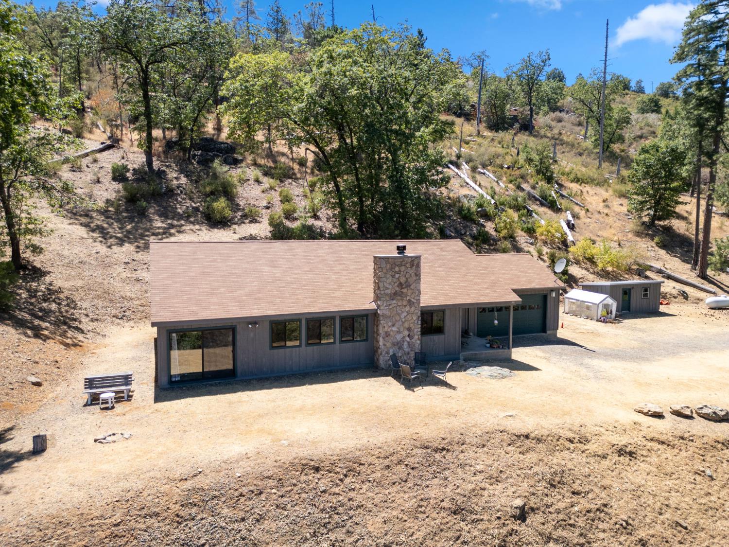5851 Mt Bullion Ridge Road Mariposa, CA 95338 - Photo 3 of 83 a front view of a house with a yard covered in snow