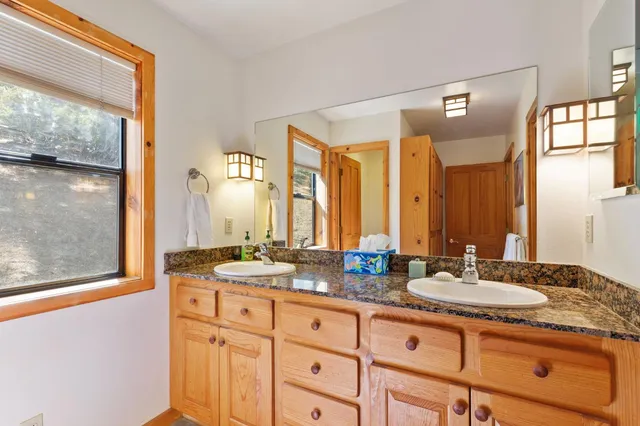 a view of a house with a snow on the road